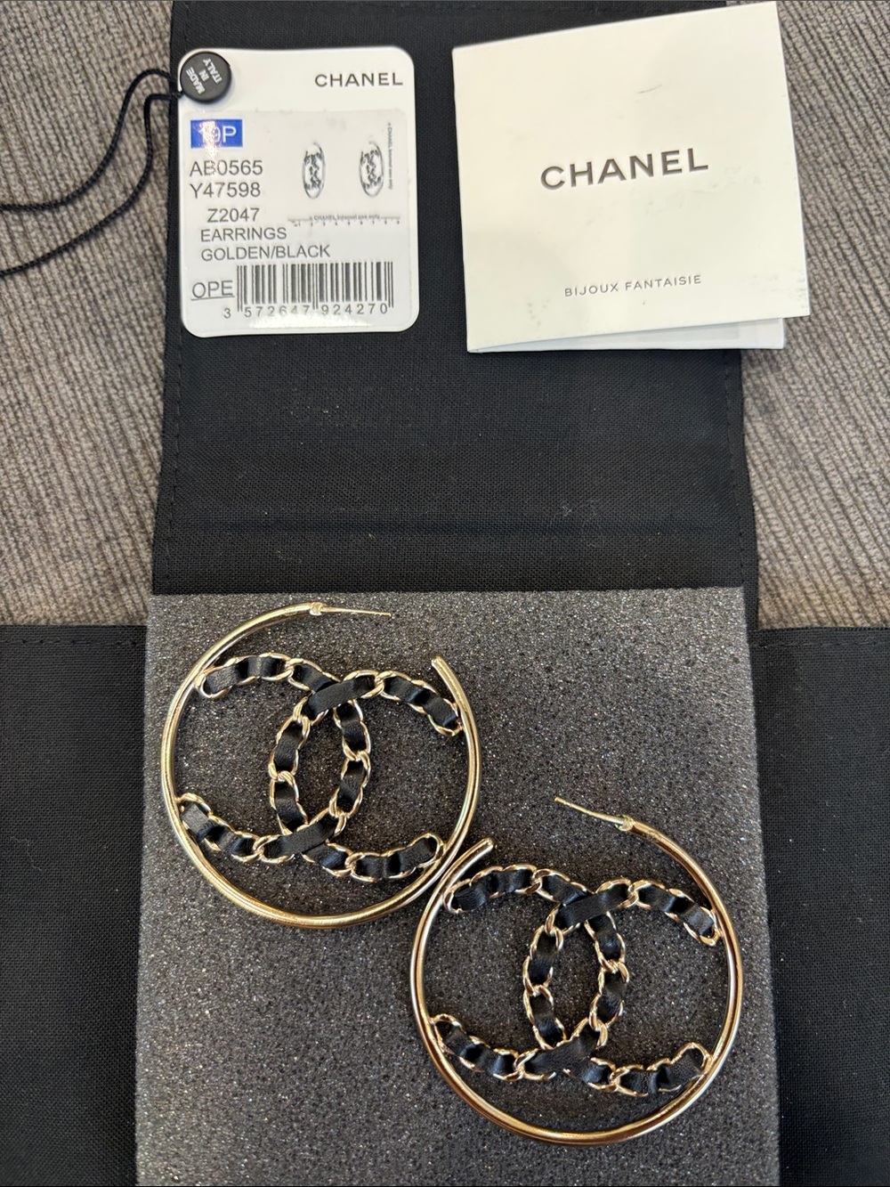 CHANEL Gold and Black Interwoven CC Hoop Earrings